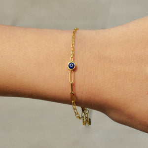 gold split chain bracelet with an evil eye