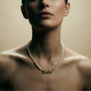 Woman wearing a pearl necklace with 'Katie' on a beige background