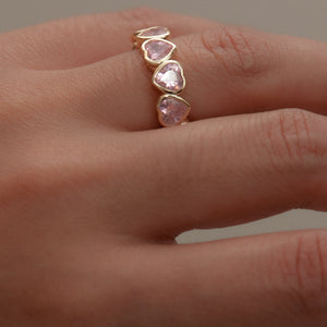 pink colored stone heart eternity band
