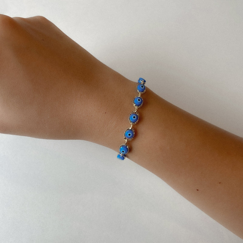 bracelet with light blue evil eyes