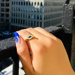 gold oval evil eye ring with colored stone