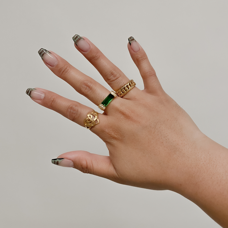emerald ring on models hand
